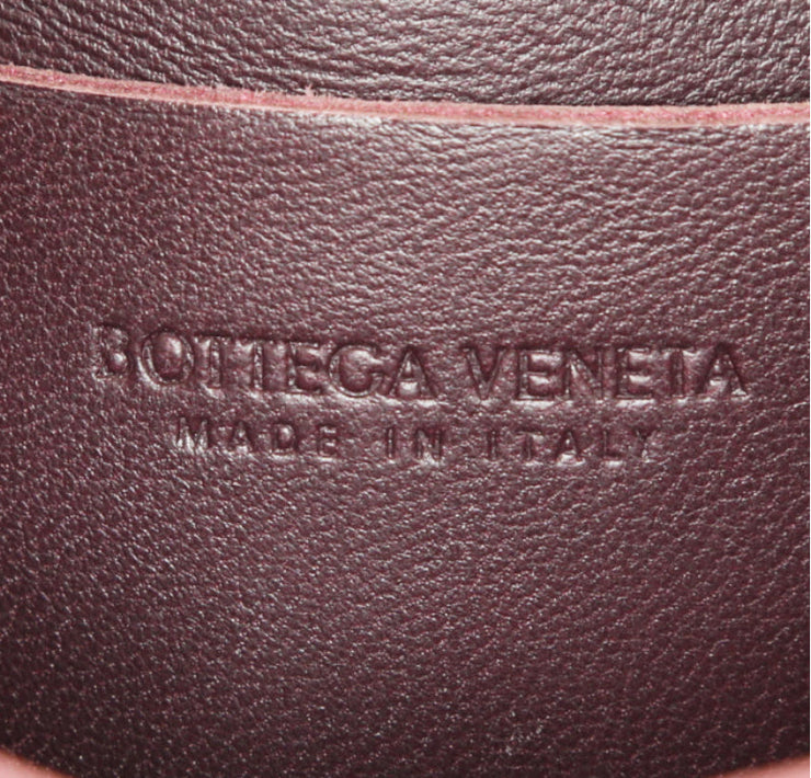 Pochette-cintura Bottega Veneta Cassette in pelle intrecciata plum