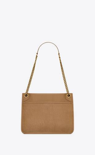 NIKI MEDIA IN PELLE DI AGNELLO MARTELLATA