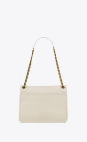 NIKI MEDIA IN PELLE DI AGNELLO MARTELLATA