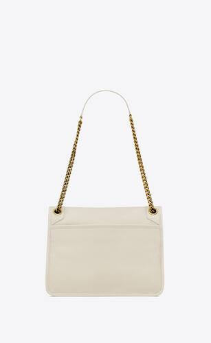 NIKI MEDIA IN PELLE DI AGNELLO MARTELLATA